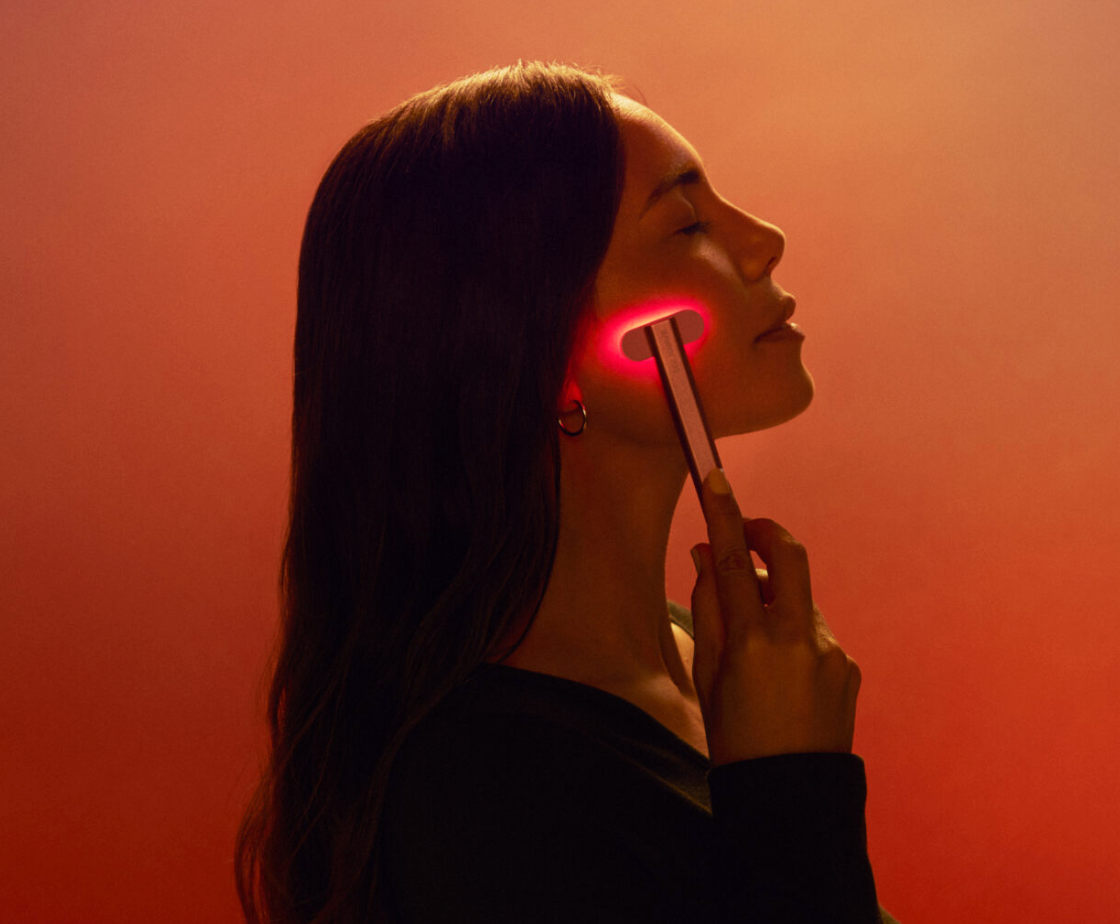 LED skincare wand being used as part of a glow routine