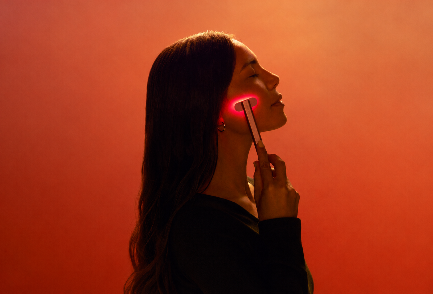 LED skincare wand being used as part of a glow routine